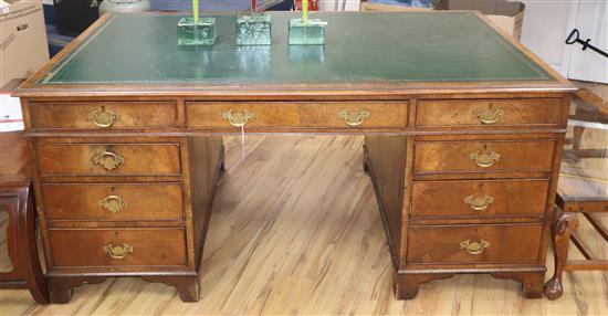 A George III style walnut pedestal desk W.168cm